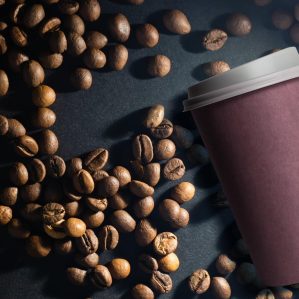 photo-paper-coffee-cup-with-mixture-arabica-robusta-beans-background (1)